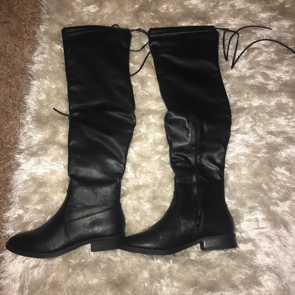 SOLD. Leather black knee high boots